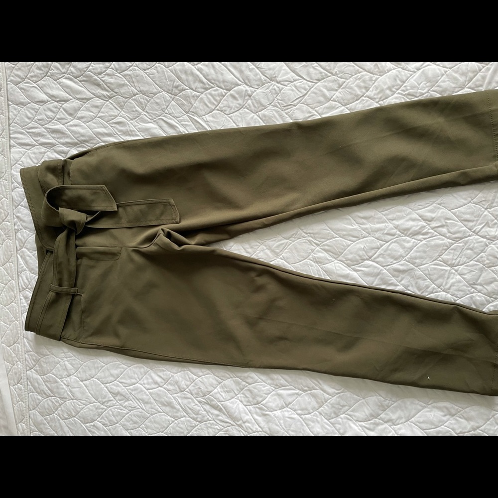 Gabriele Union green slacks with ankle snap detail